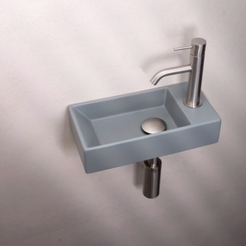 Lille blå håndvask til det lille badeværelse