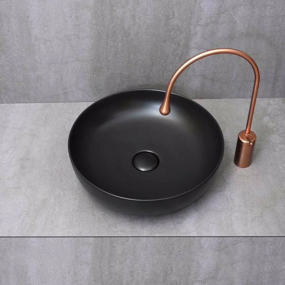 Mat sort håndvask i rund design til bordplade