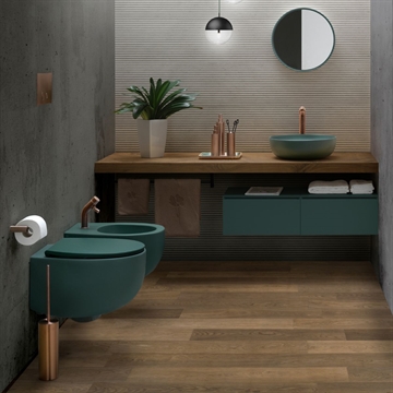 Badeværelse med toilet og håndvask i mat grøn farve